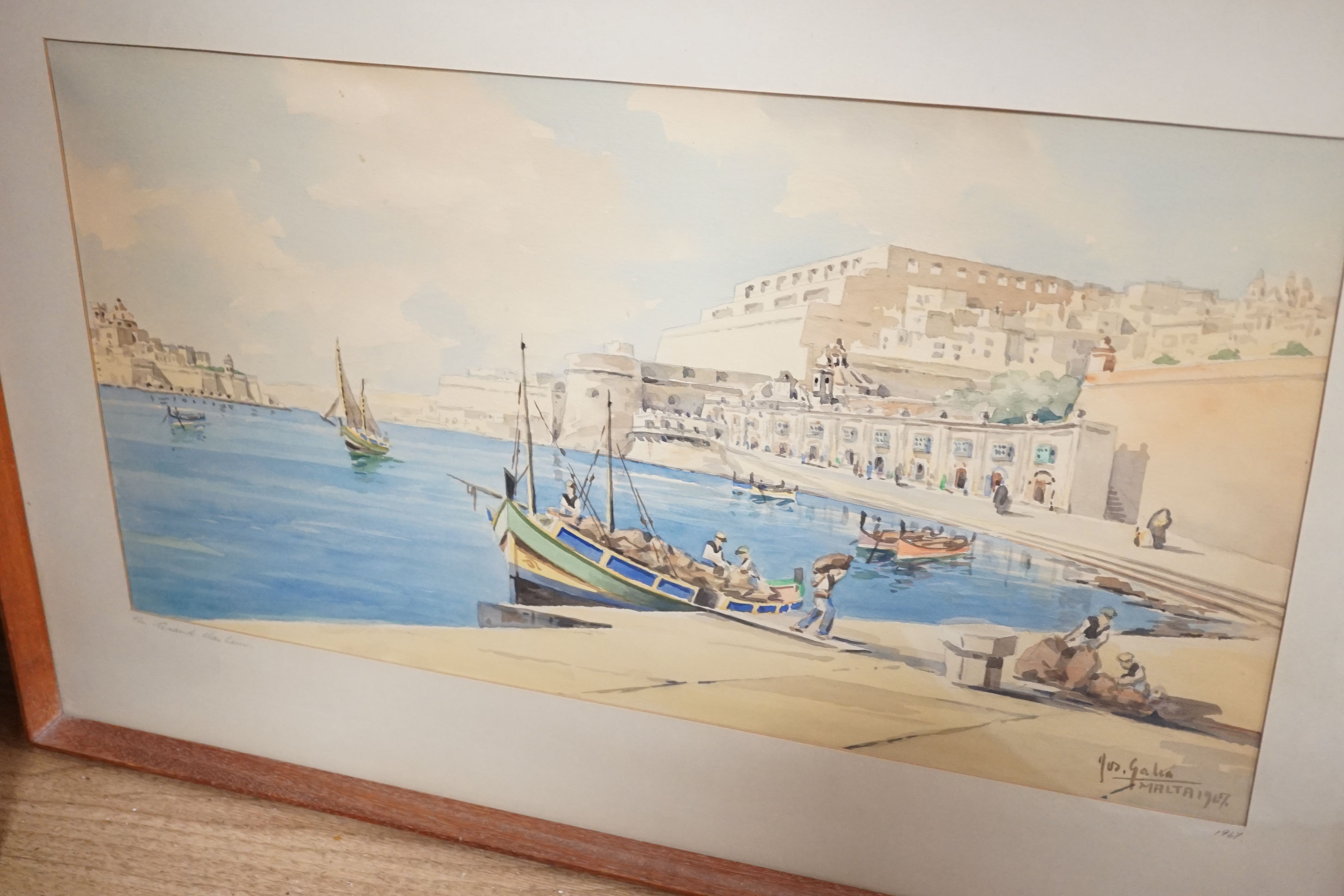 Joseph Galea (Maltese, b.1934), two watercolours, 'The Grand Harbour' and 'Waterside scene with moored boats', signed and dated 1967 and 1968, largest 28 x 52cm. Condition - fair, some browning